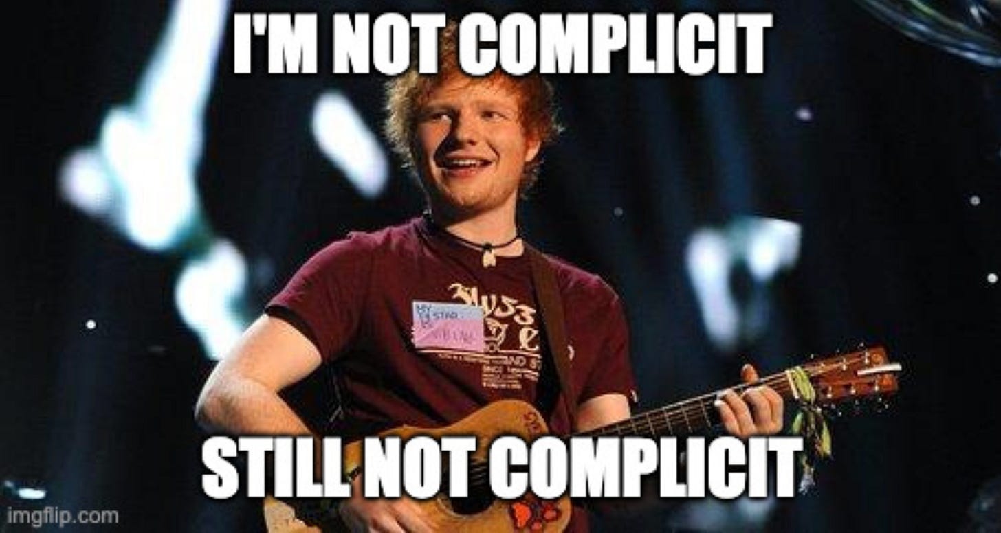 Ed Sheeran playing guitar; top text says, "I'm not complicit"; bottom says "Still not complicit" Ed Sheeran playing guitar; top text says, "I'm not complicit"; bottom says "Still not complicit"