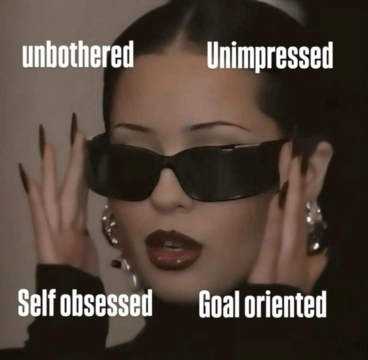 unbothered unimpressed self obsessed goal oriented photo of a fierce woman with sunglasses on