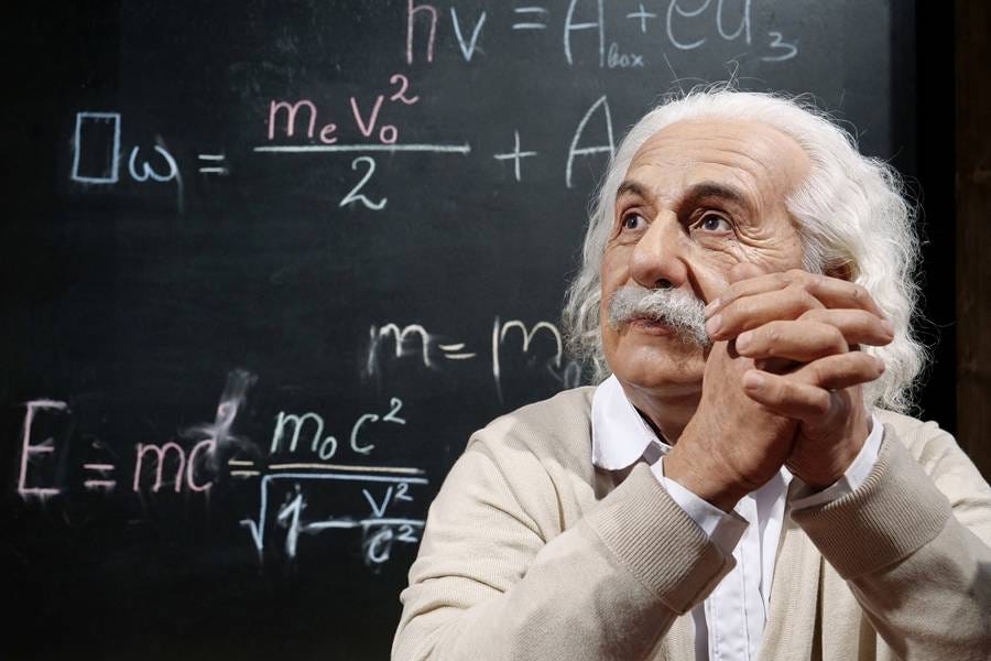 A person in front of a blackboard

AI-generated content may be incorrect.