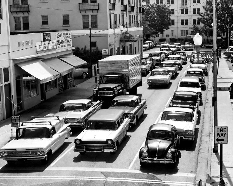 Congestion on SE First Avenue in 1961. Congestion on city and residential streets were the norm leading up to the construction of the Federal Highway System. Photo courtesy of the Miami Herald, photographer Doug Kennedy. Congestion on SE First Avenue in 1961. Congestion on city and residential streets were the norm leading up to the construction of the Federal Highway System. Photo courtesy of the Miami Herald, photographer Doug Kennedy.