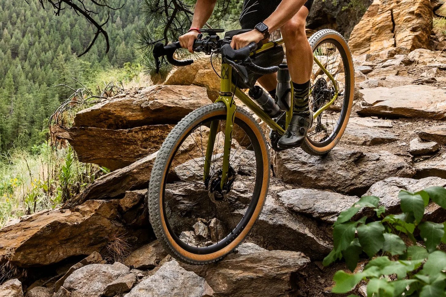 Riding the Hunt 25 Carbon Gravel X-Wide wheels down a rocky trail