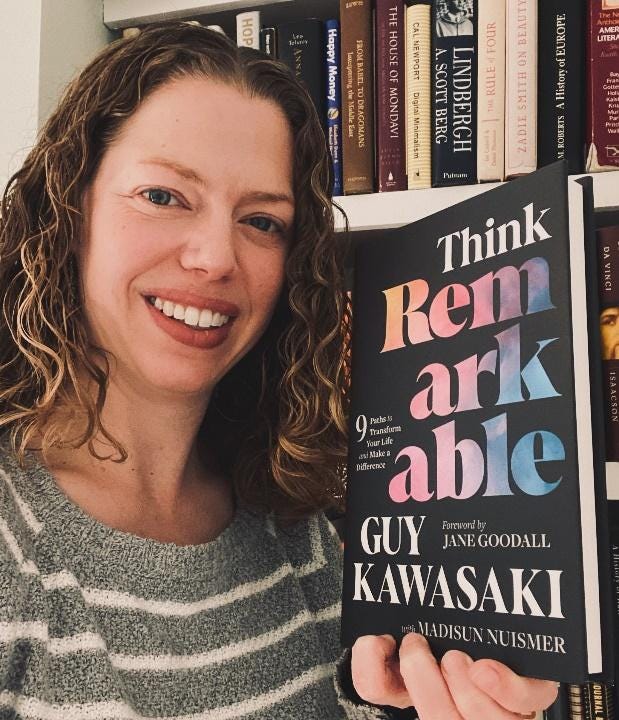 A person holding a book

Description automatically generated