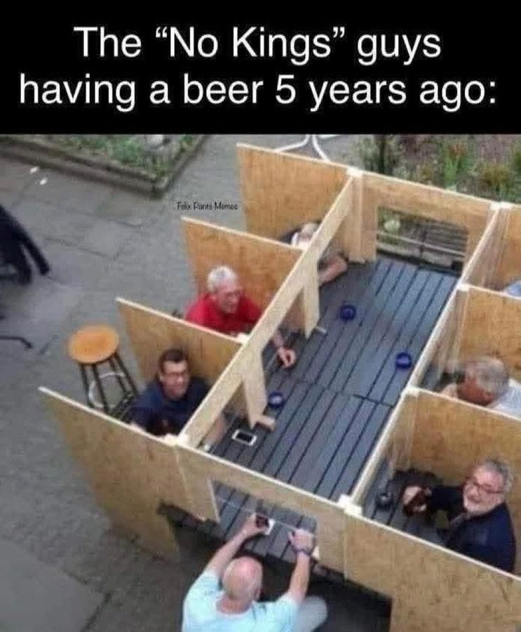 Overhead view of a wooden partitioned outdoor structure resembling a beer garden with four middle-aged men sitting on stools around a table, one man in red shirt, another in blue shirt, one in gray shirt, and one bald man in light blue shirt kneeling outside holding a phone, blue cups and a phone on the table, labeled The No Kings guys having a beer 5 years ago at top, Fake News at bottom.