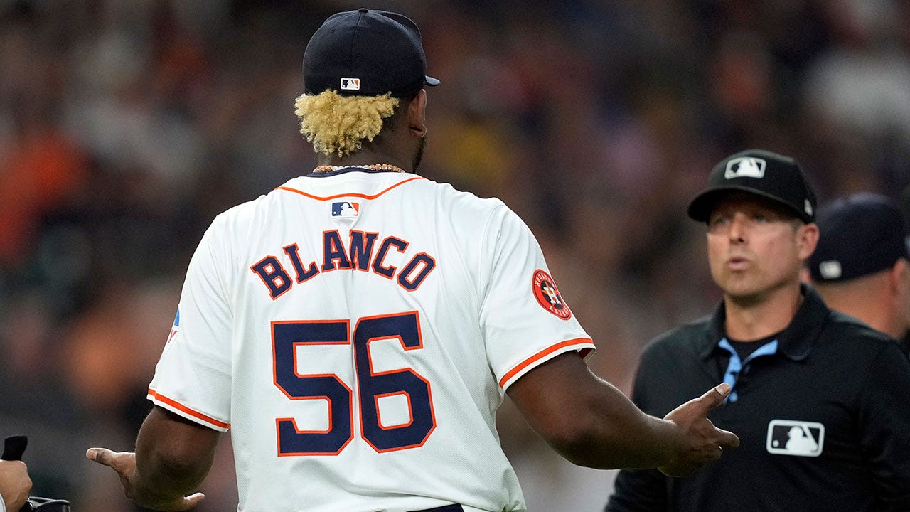 Houston Astros starting pitcher Ronel Blanco (56) talks with second base umpire Tripp Gibson after being ejected following a foreign substance check on May 14, 2024.