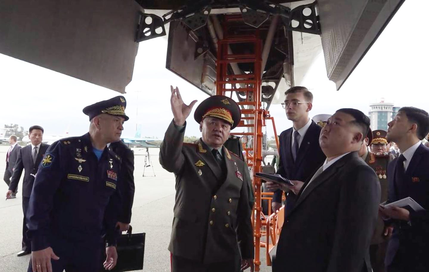 (Left to right): Russia’s Long-Range Aviation Commander Lieutenant General Sergey Kobylash, Russian Minister of Defense Sergey Shoigu, and North Korean leader Kim Jong Un look at a Tu-160 bomber at Knevichi Airfield in Russia’s Far East. <em>Russian Ministry of Defense</em><br> (Left to right): Russia’s Long-Range Aviation Commander Lieutenant General Sergey Kobylash, Russian Minister of Defense Sergey Shoigu, and North Korean leader Kim Jong Un look at a Tu-160 bomber at Knevichi Airfield in Russia’s Far East. <em>Russian Ministry of Defense</em><br>