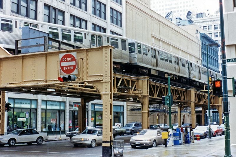 An iconic 'L' train curves from Wabash Avenue to Lake Street, high above the Loop, Chicago, February 1996. An iconic 'L' train curves from Wabash Avenue to Lake Street, high above the Loop, Chicago, February 1996.