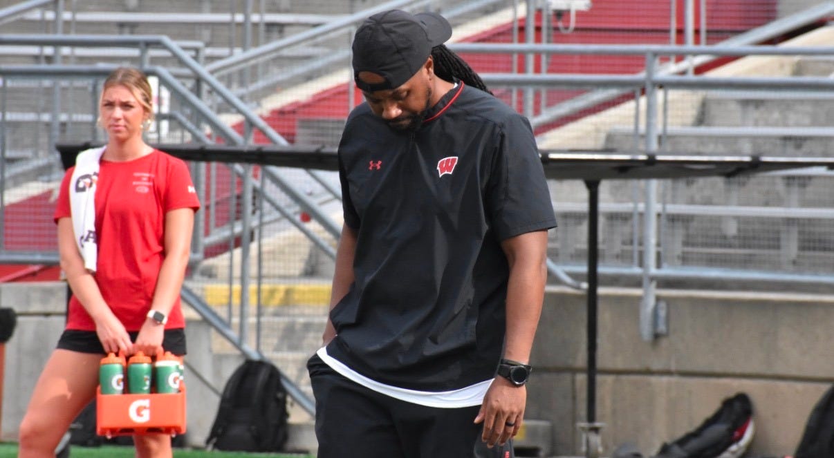 Wisconsin Badgers cornerbacks coach Robert Steeples on the field during fall camp practice. Wisconsin Badgers cornerbacks coach Robert Steeples on the field during fall camp practice.