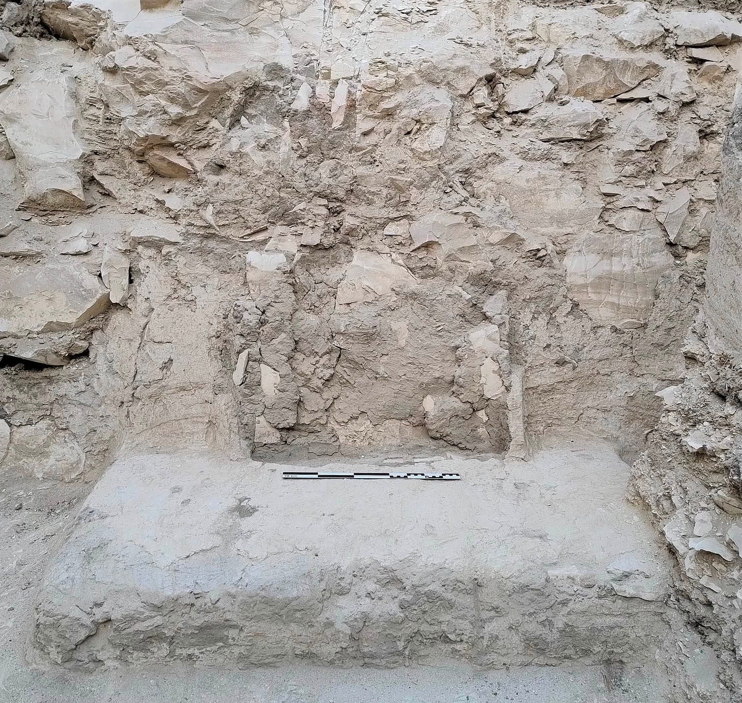 The mudbrick entrance structure with its central niche, designed to hold a funerary stela, uncovered at the tomb of Sheikh Abd al-Qurna al-Sufla. Photo Ministry of Tourism and Antiquities.
