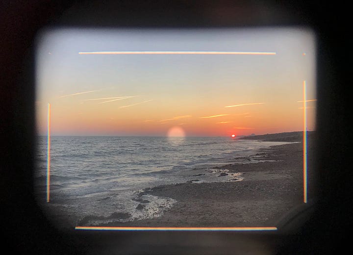 Sunset seen through a film camera rangefinder, and the resulting image on transparency film.