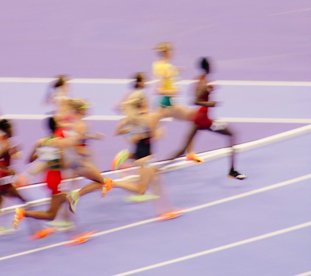A group of people running on a track