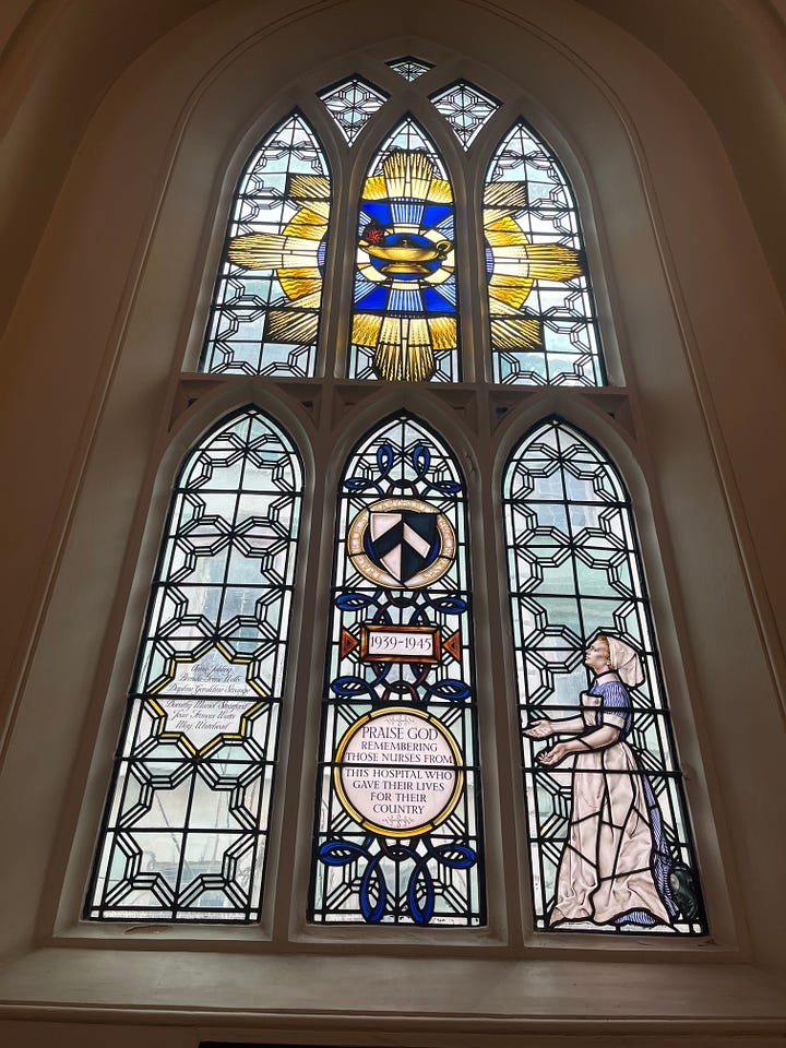 Stained glass and exterior architectural details of the church of St Bartholomew the Less at Barts.