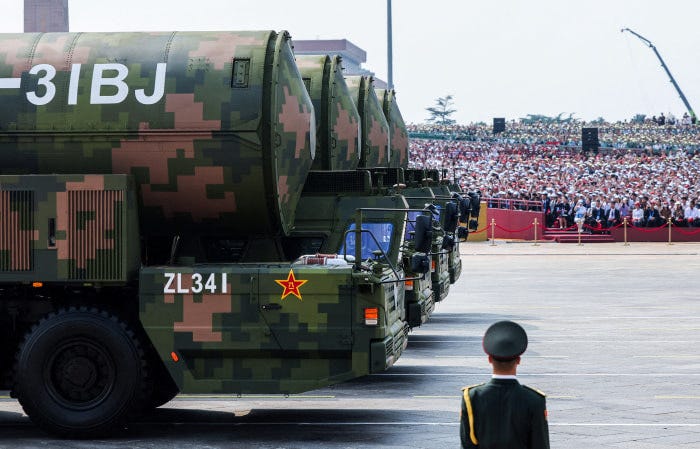 A People's Liberation Army soldier stands in front of a row of DF-31BJ nuclear missiles during a military parade in Beijing. A People's Liberation Army soldier stands in front of a row of DF-31BJ nuclear missiles during a military parade in Beijing.