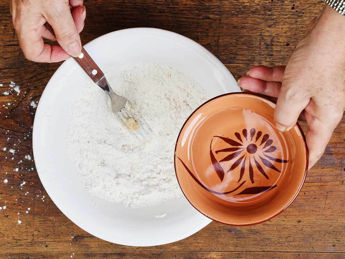 Adding Water to Buñuelo Dough