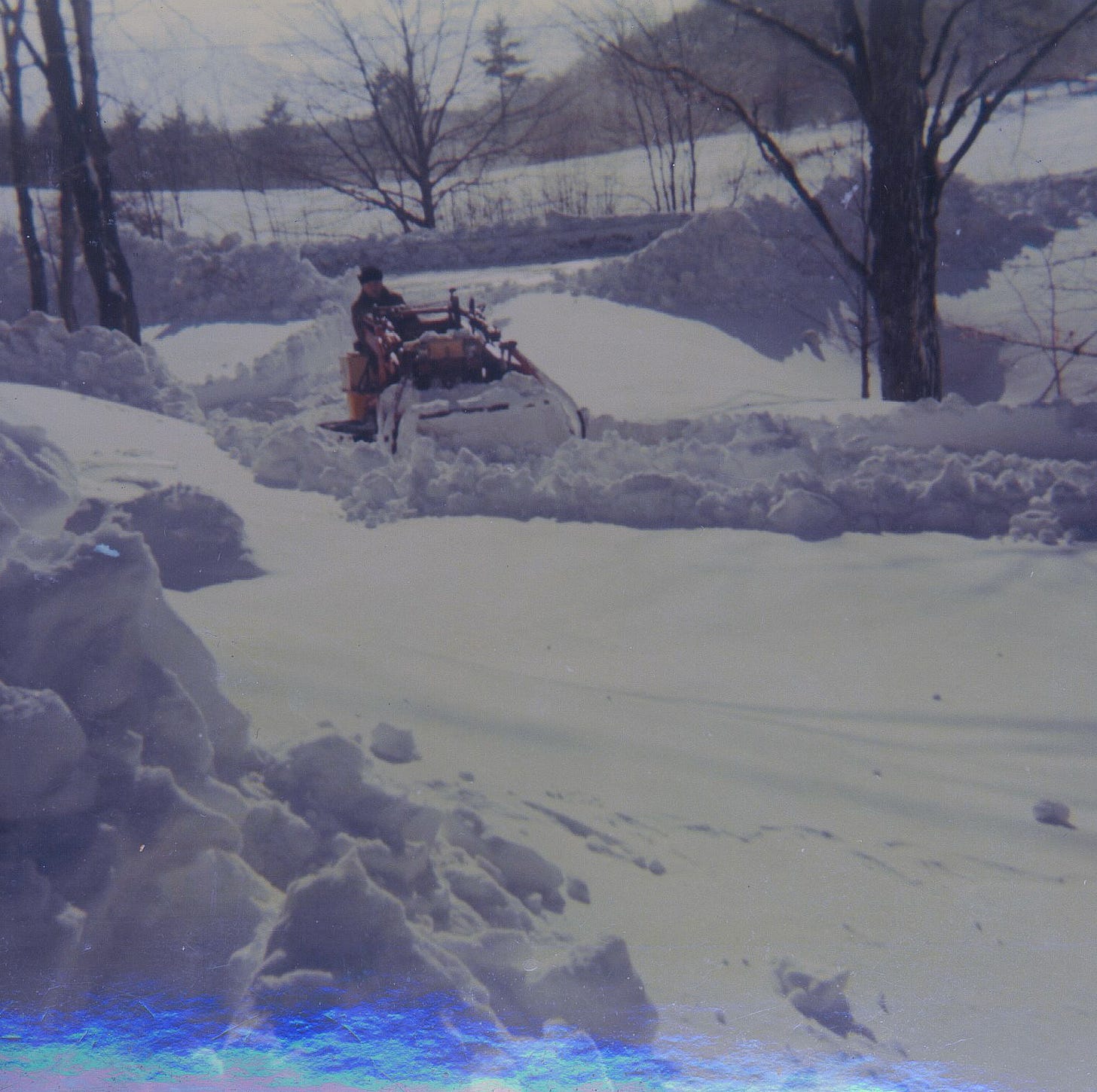 Clearing driveway with tractor