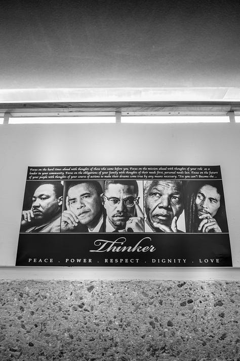 library books, image of MLK Jr. with then-college president, poster of Black leaders and inspirations, flowers, books