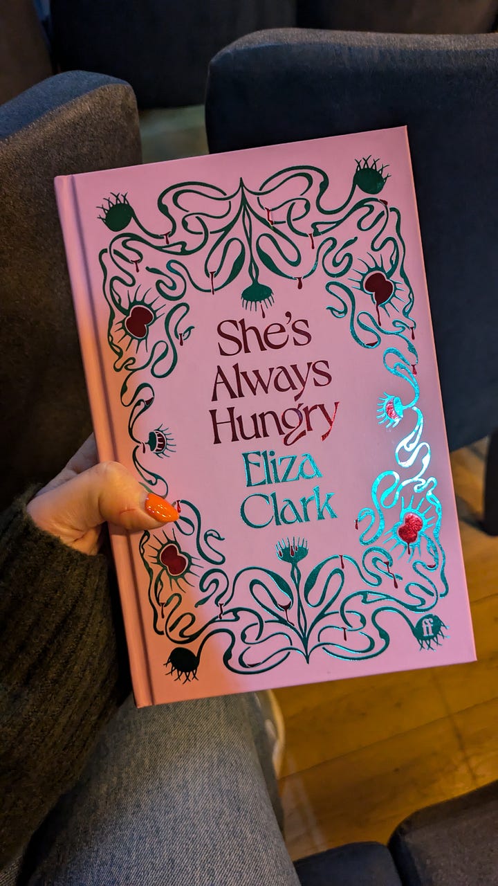 Outside cover and title page of She's Always Hungry signed by Eliza Clark