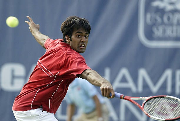 Rajeev Ram of the USA reaches for a shot against Wesley Moodie of the USA during the RCA Tennis Championships on July 19, 2004 at the Indianapolis...