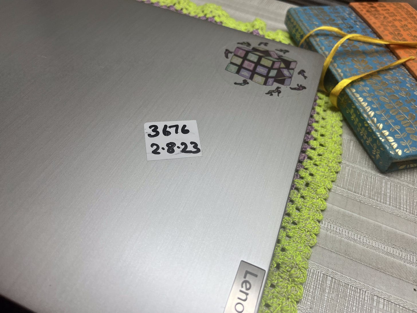 A laptop with a sticker on it