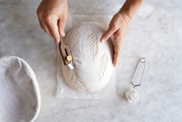 Sourdough Bread step by step showing all ingredients, then autolyse then folding and scoring