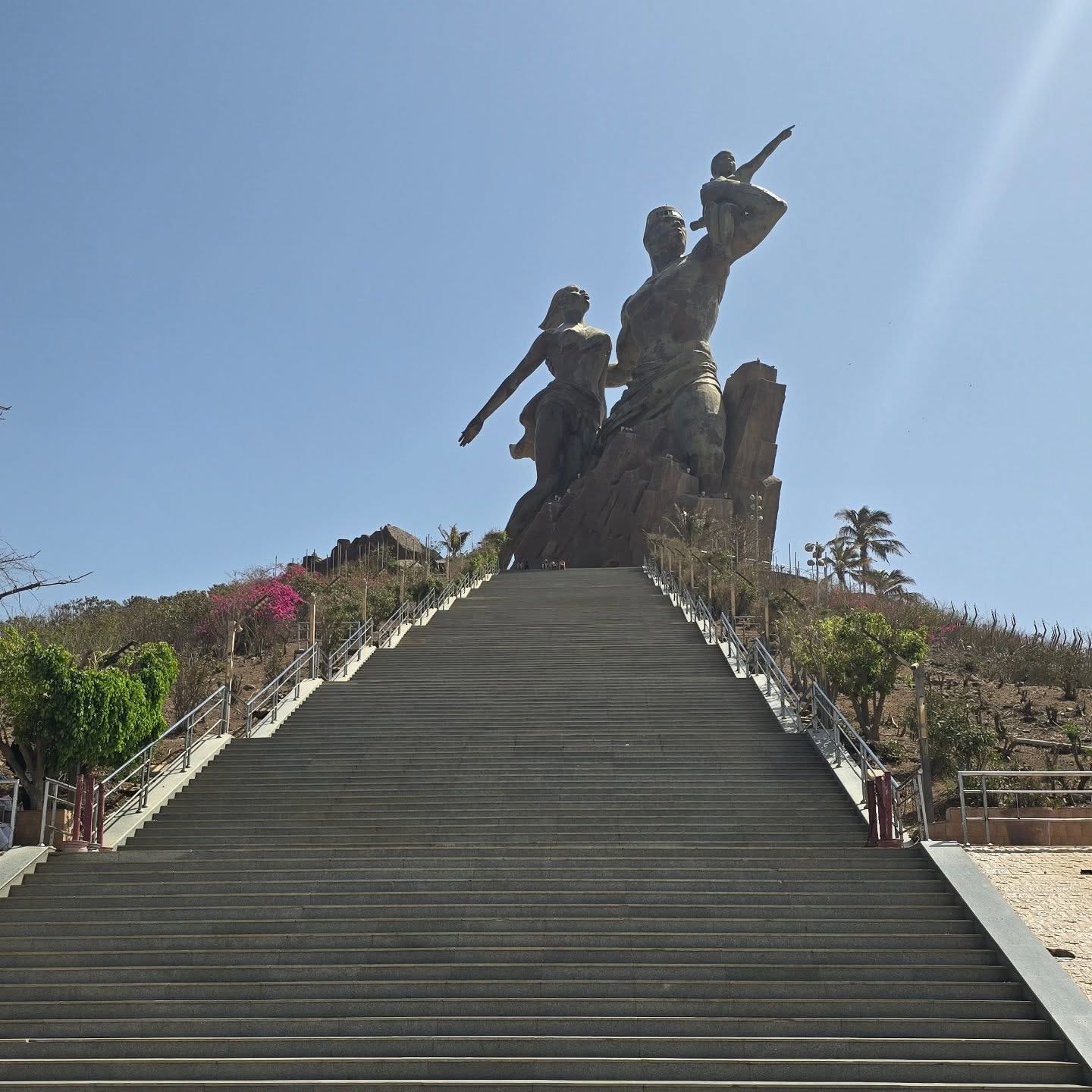 Looking up the stairs at the African Renaissance Monument in Dakar, Senegal, under a hazy harmattan sky. Looking up the stairs at the African Renaissance Monument in Dakar, Senegal, under a hazy harmattan sky.