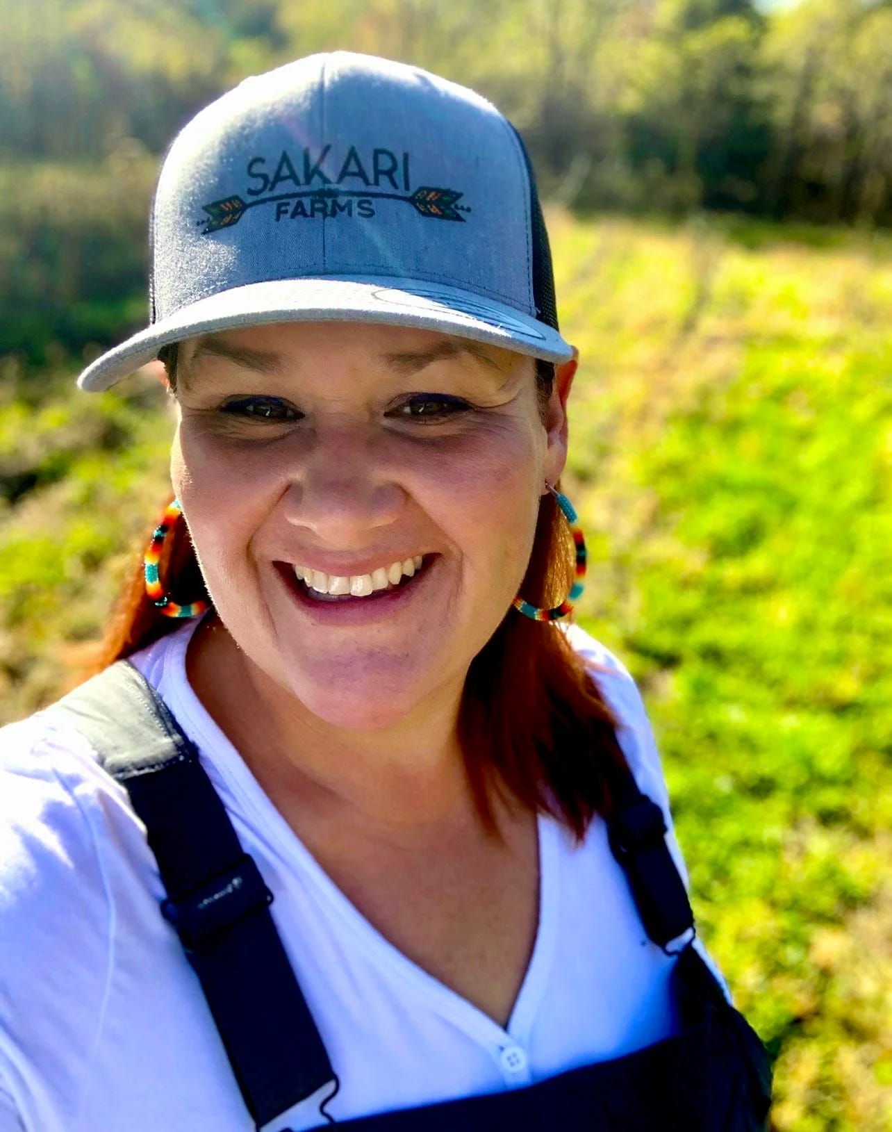 Chef Elena Terry outside standing in a field