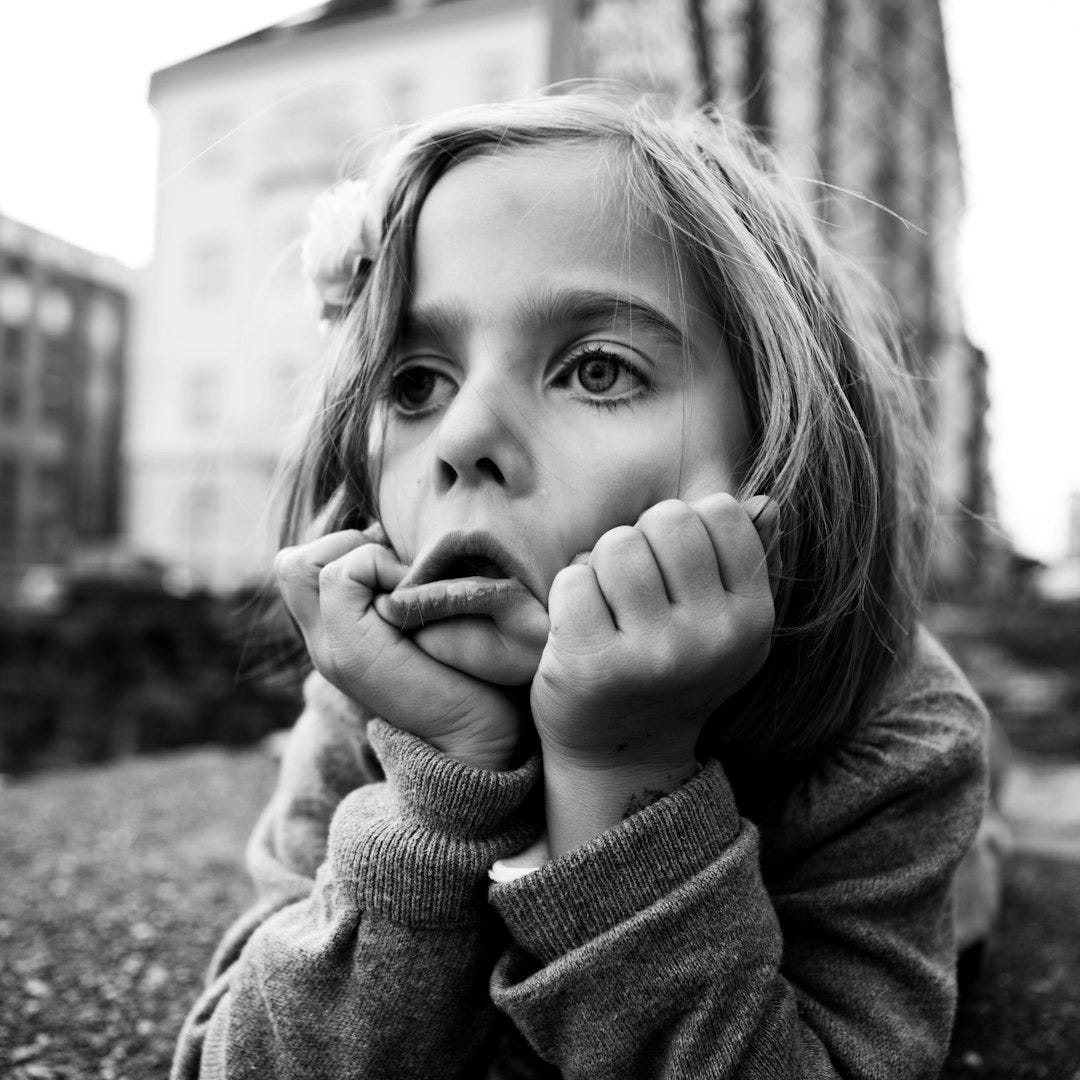 grayscale photo of girl doing face palm grayscale photo of girl doing face palm