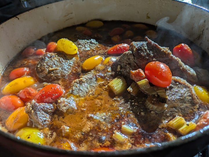 Braised beef with oxtail and veggies showing meat consistency and adding a few fresher veggies near the end of the process for brighness.