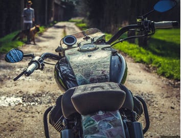A motorcycle on a dirt road

AI-generated content may be incorrect.