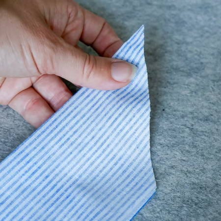 showing the tip of the fabric strip showing the tip of the fabric strip