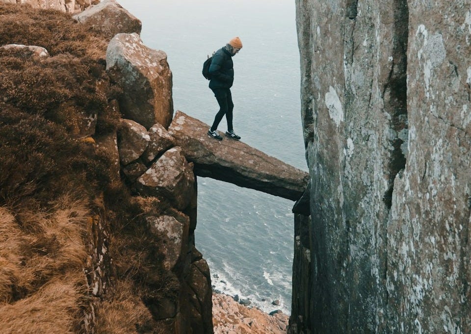man standing on rock in the middle of clip man standing on rock in the middle of clip