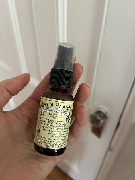 A hand holding a hand sanitizer spray bottle; a green glossy box tissue cover; a flat lay of supplements; a to-go cup of soup; the book cover for Nicotine by Nell Zink; linen striped sheets