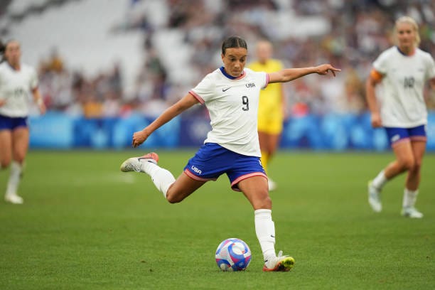 Mallory Swanson of the United States strikes the ball during the second half against Australia during the Women's group B match during the Olympic... Mallory Swanson of the United States strikes the ball during the second half against Australia during the Women's group B match during the Olympic...