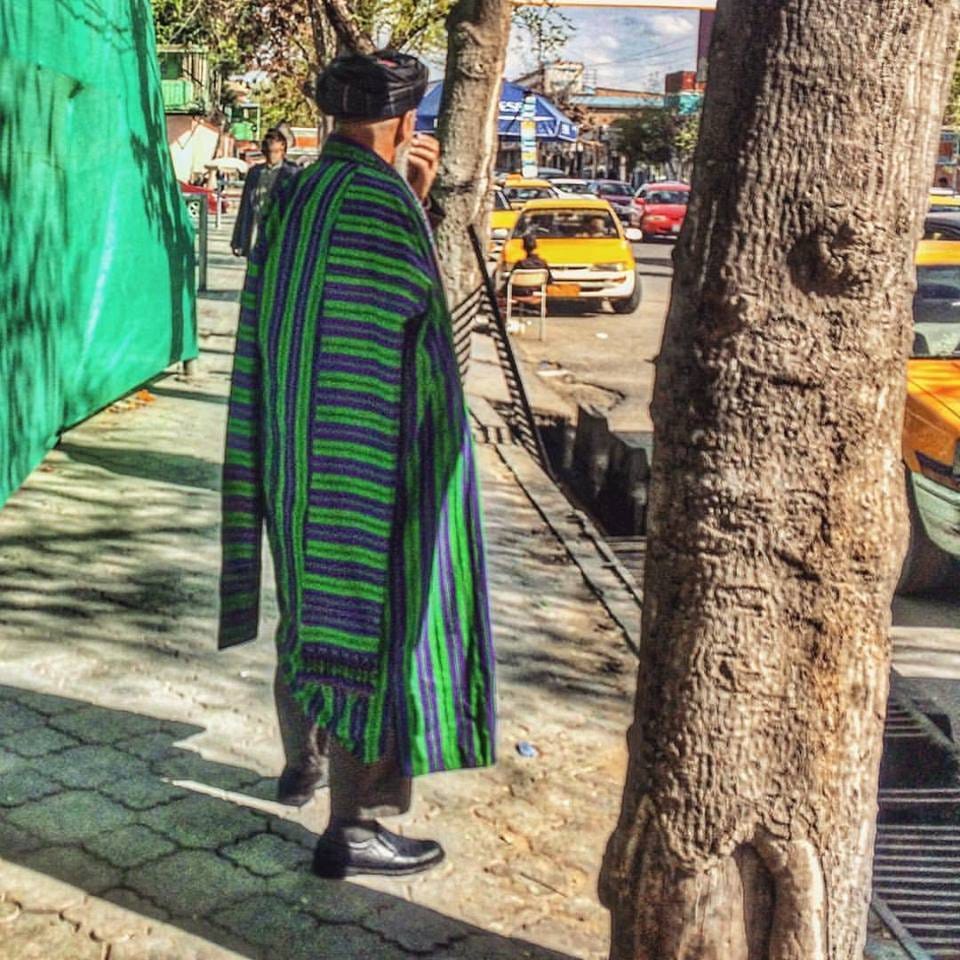 Picture of an Afghan man in Kabul wearing a traditional chapan coat Picture of an Afghan man in Kabul wearing a traditional chapan coat