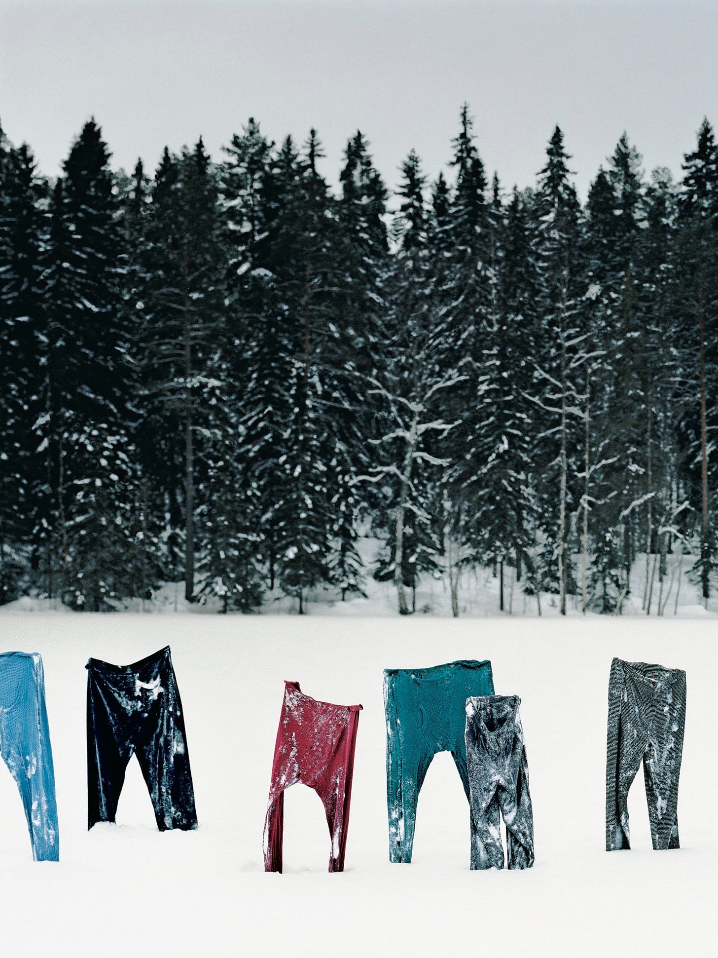 Pants on a clothesline outdoors in the snow. Pants on a clothesline outdoors in the snow.