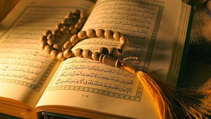 Tasbeeh spread over Quran Tasbeeh spread over Quran