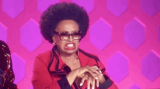 Jenifer Lewis baring teeth and writing hands in an "awkward" feeling way