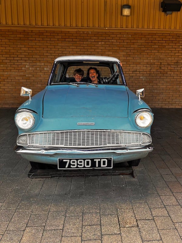 Becky and Hudson in a flying car at Warner Bros. Studio Tour London
