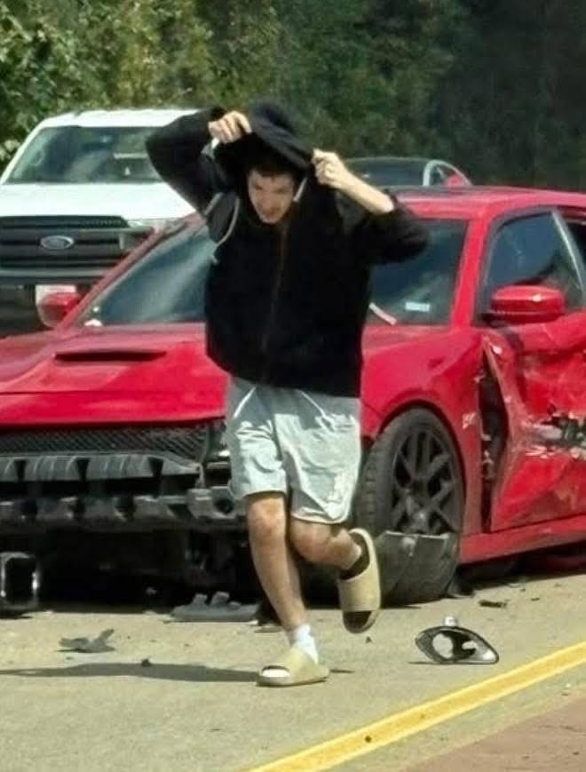 May be an image of 1 person, car and road