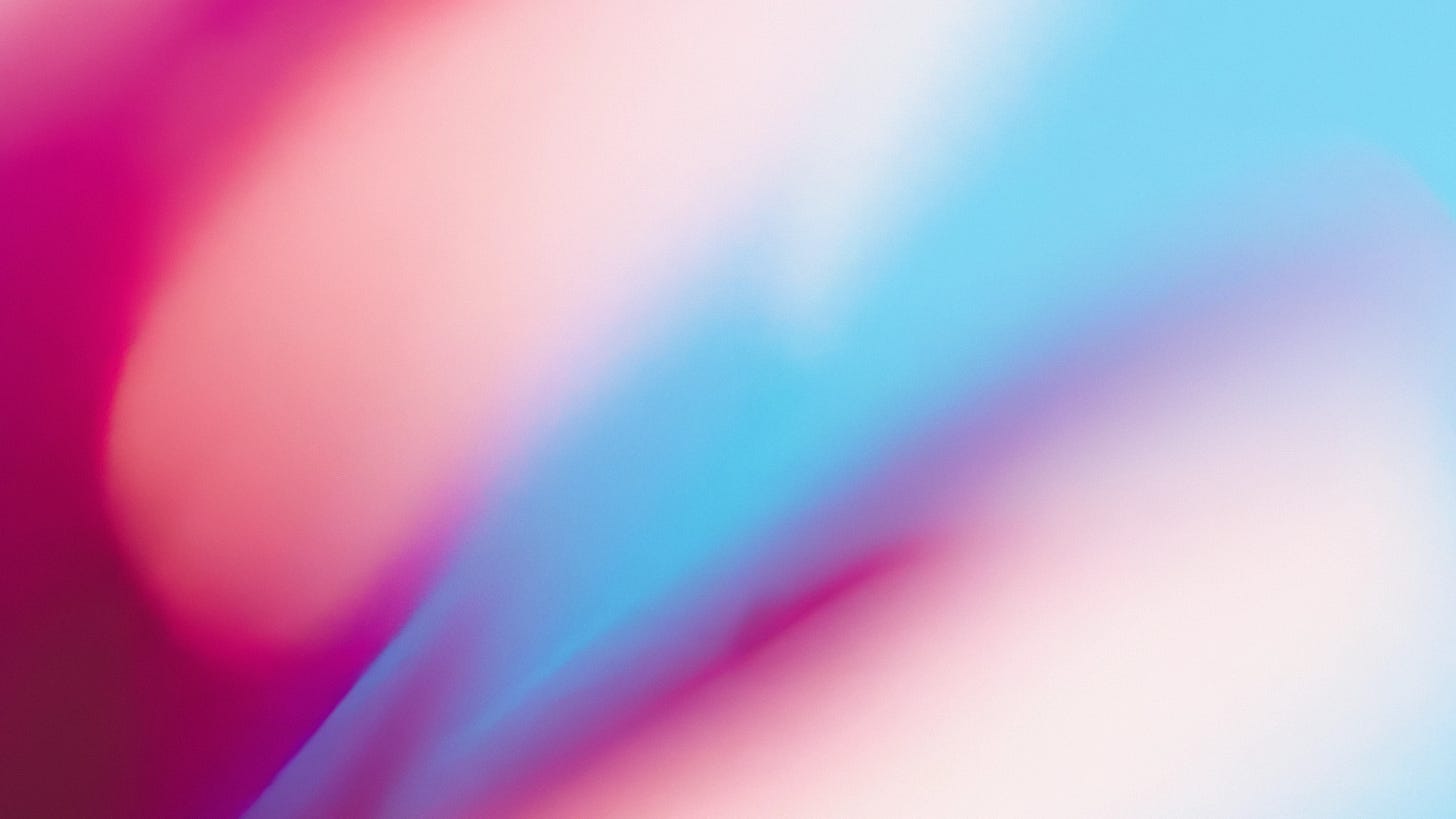 Abstract image with blended gradients of magenta, pink, light blue, and purple, creating a vibrant and dreamy visual effect.