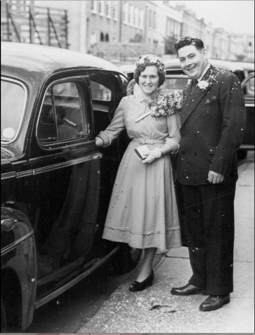 Black and white photo of married couple with Best Man and Bridesmaid, 1950