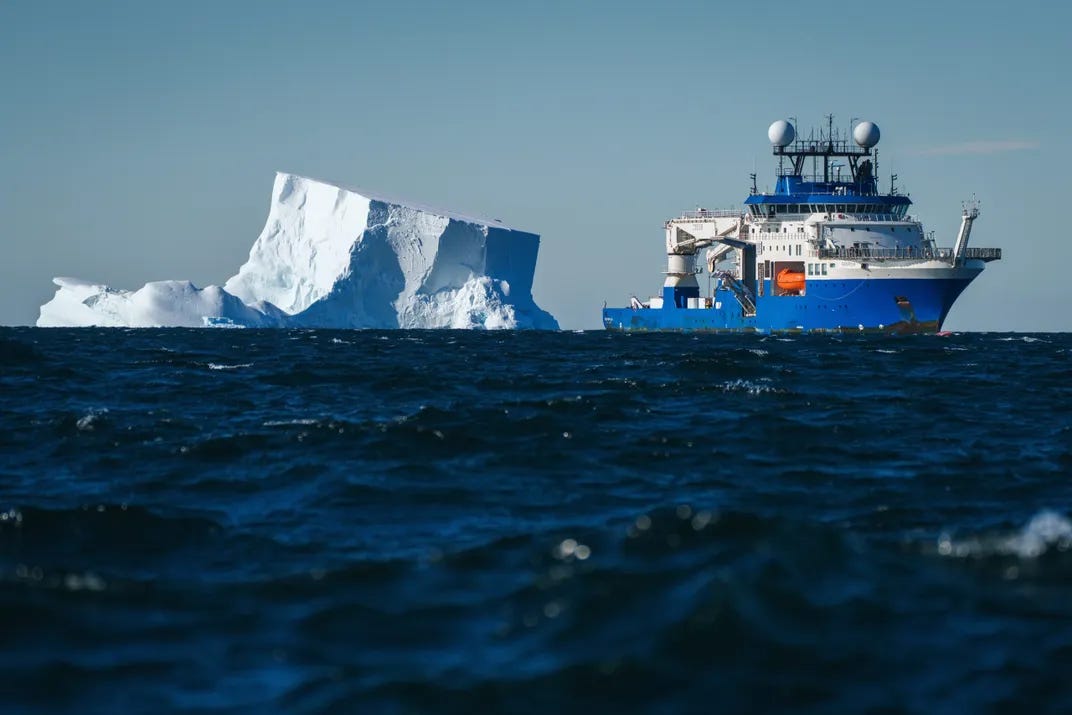 Research vessel near iceberg Research vessel near iceberg