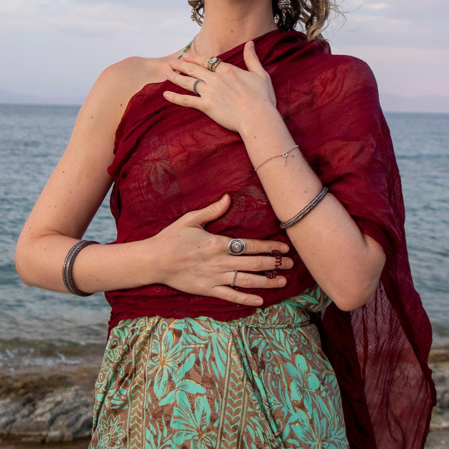 woman with the sea behind her