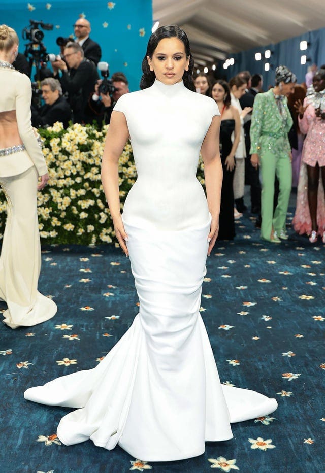 Rosalía in Balmain by Oliver Rousteing at the 2025 Met Gala: “Superfine:  Tailoring Black Style." Her look is inspired by a mannequin, a blank slate  for a designer's tailoring and creativity. (Bonus: