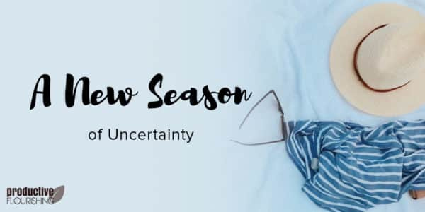 A sun hat and other beach items sit on a white towel. Text Overlay: A New Season of Uncertainty A sun hat and other beach items sit on a white towel. Text Overlay: A New Season of Uncertainty