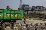 Workers at a concrete block manufacturing factory near a coal-fired thermal power plant in the outskirts of Visakhapatnam, Andhra Pradesh, India. Workers at a concrete block manufacturing factory near a coal-fired thermal power plant in the outskirts of Visakhapatnam, Andhra Pradesh, India.