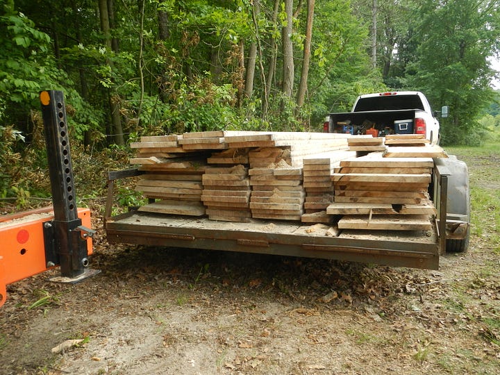 lumber from three logs ready for transport