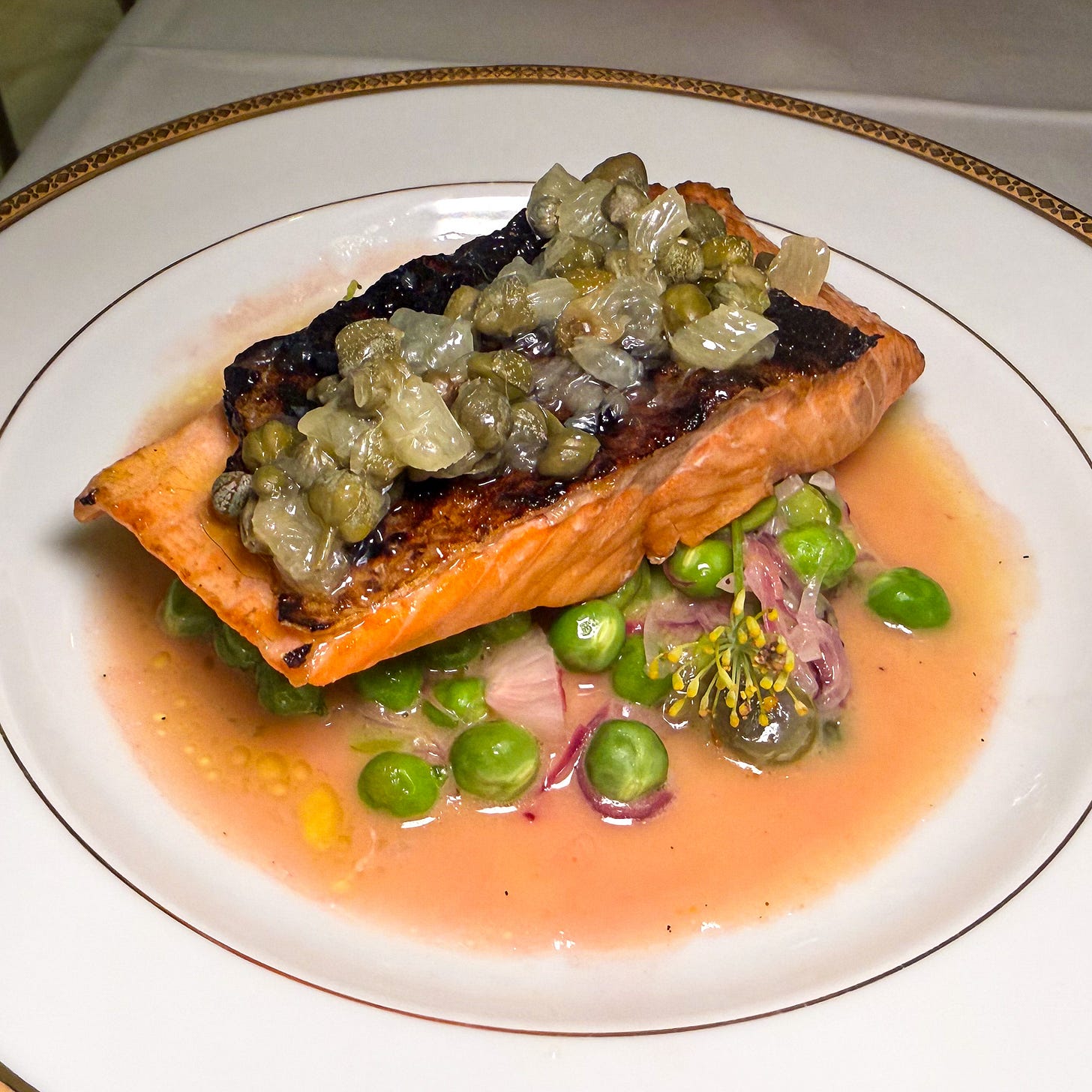 Trout with peas, fava beans, capers and blackened skin in a lemon-caper sauce at Petit Vatel, Paris 6th Trout with peas, fava beans, capers and blackened skin in a lemon-caper sauce at Petit Vatel, Paris 6th
