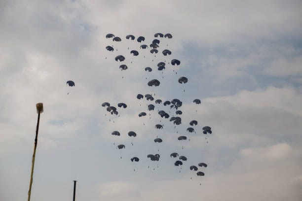 Military plane drops humanitarian aid near Khan Yunis in the southern Gaza Strip on October 17, 2024 amid the ongoing war in the Palestinian...