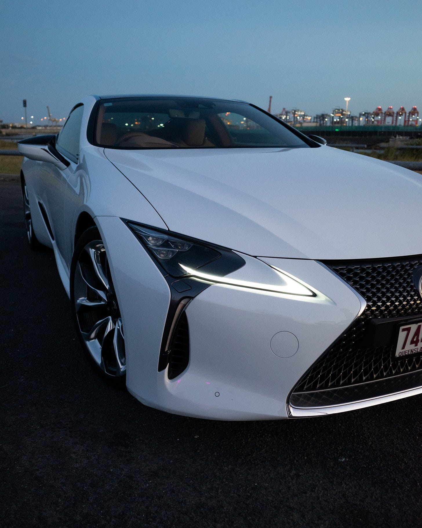 A digital photo of Clem's car, a tight angle shot showing off the headlight and front wheel