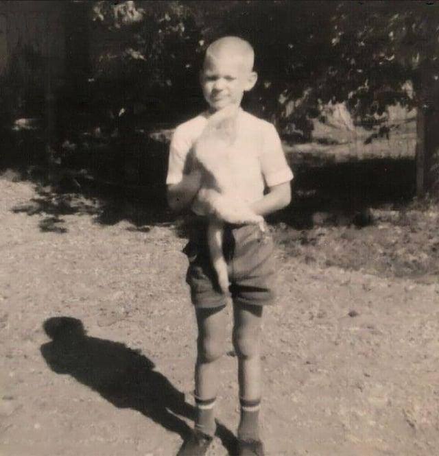 r/LPOTL - a young person holding a cat